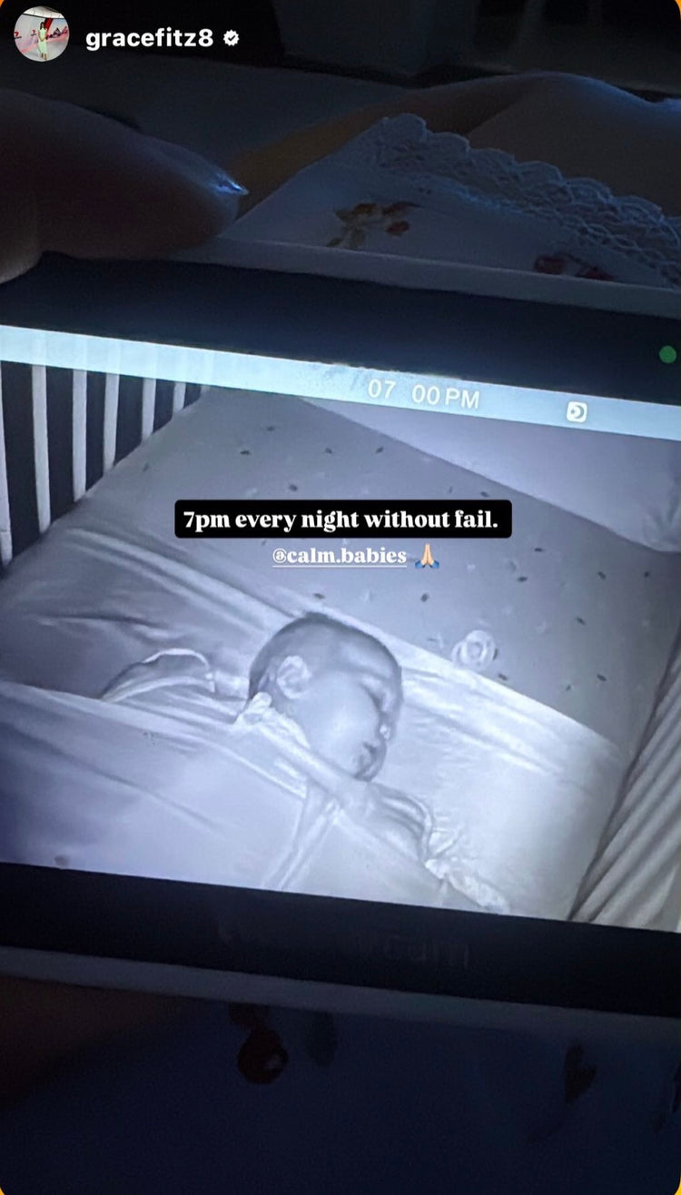 Baby monitor screen showing a baby in a crib with text overlay, tagging Calm Babies for getting baby to sleep through the night 