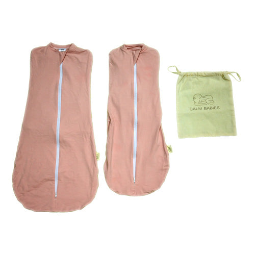 Two pink baby swaddle blankets with a green drawstring bag labeled 'Calm Babies' on a white background.