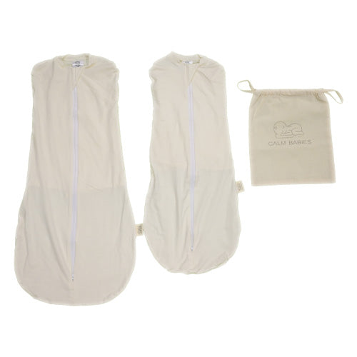 Two beige baby calm swaddle blankets with a small drawstring bag on a white background