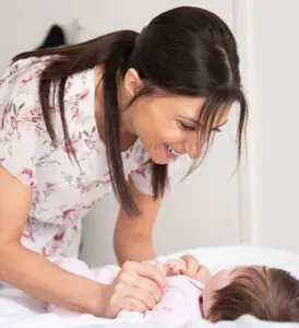 Calm Babies owner, Carmel Morabito working with a newborn baby to implement a sleep routine